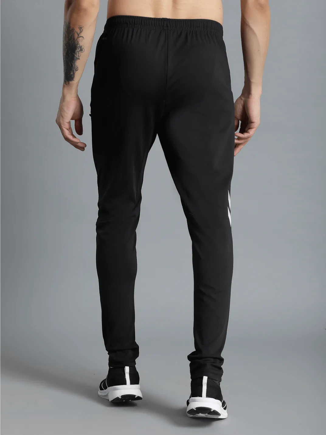 Football Solid Regular fit Polyester Trackpants for Men with zipper pockets Comfortable Breathable Fabric Stretchable for Everyday Use Ideal for Yoga Training Gym Running or Performance