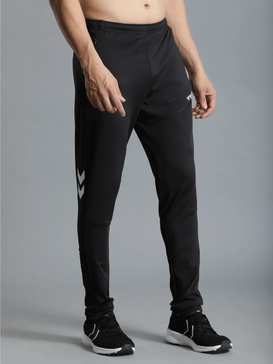 Football Solid Regular fit Polyester Trackpants for Men with zipper pockets Comfortable Breathable Fabric Stretchable for Everyday Use Ideal for Yoga Training Gym Running or Performance