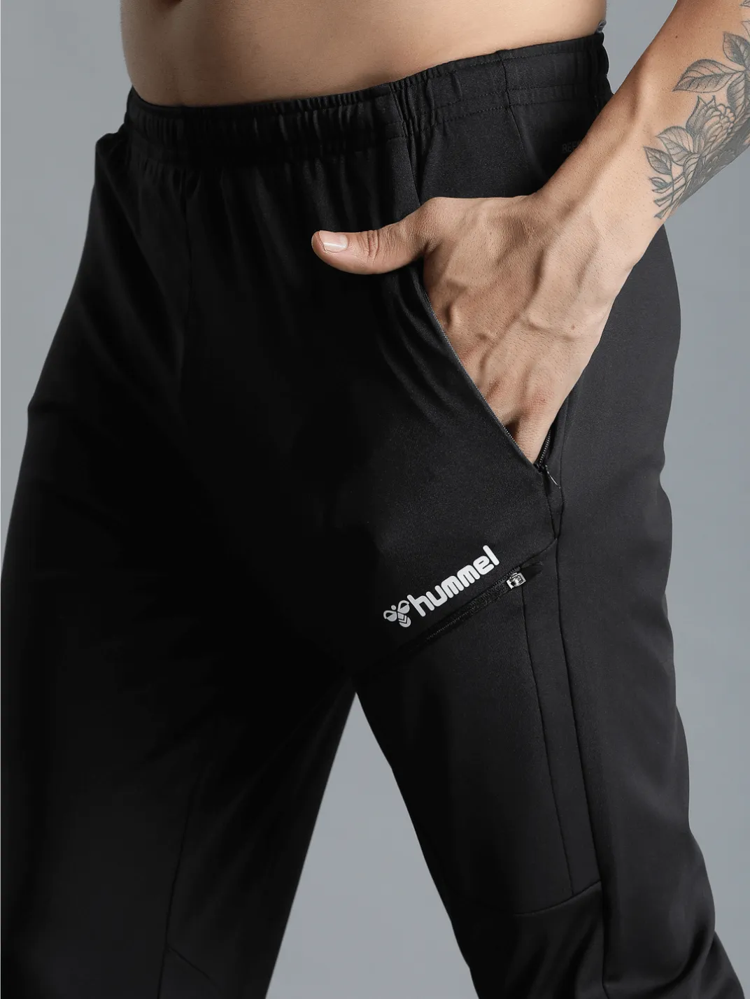 Football Solid Regular fit Polyester Trackpants for Men with zipper pockets Comfortable Breathable Fabric Stretchable for Everyday Use Ideal for Yoga Training Gym Running or Performance